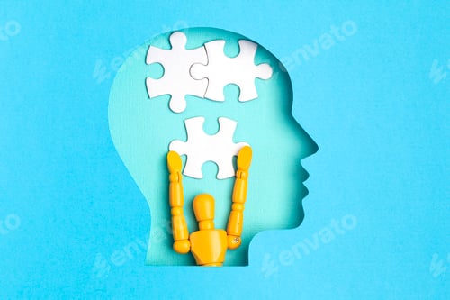 Preview: Papercut head with jigsaw puzzle pieces inside. Mental health problems, psychology, memory, logic