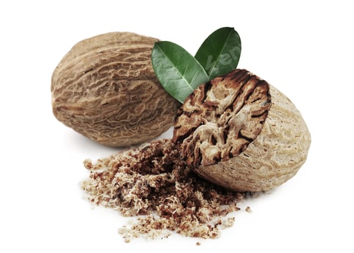 Preview: Nutmeg seeds with green leaves on white background. Aromatic spice