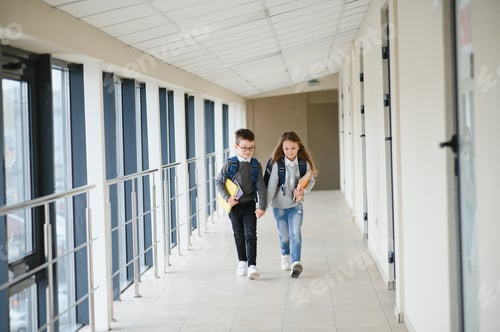 Preview: Cute pupils running down the hall at the elementary school