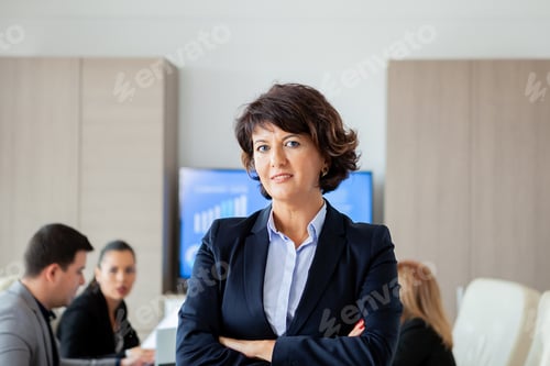 Preview: Middle aged business woman in conference room.