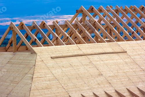 Preview: Wooden house roof frame under construction.