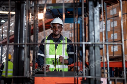Preview: Industry warehouse worker in helmets with produce order details and checking goods supplies on boxes