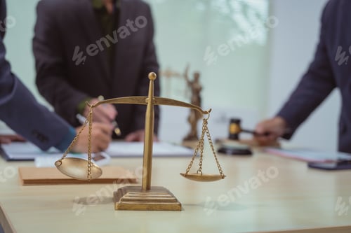 Preview: Three lawyers in a meeting at the table in an office, discussing business,civil and commercial law