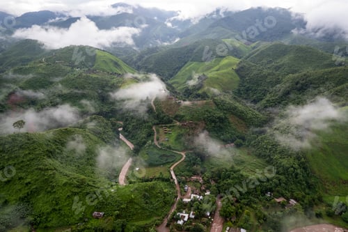 Preview: Landscape of Morning Mist with Mountain Layer. mountain ridge and clouds in rural jungle bush forest