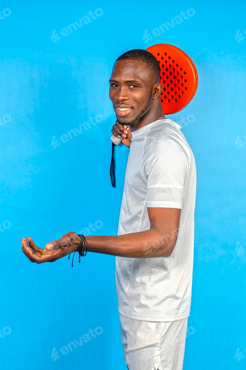 Preview: Young athlete holding a red paddle on blue background