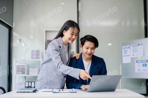 Preview: Portrait of success business people working together in office. Couple teamwork startup concept