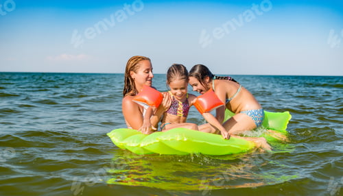Preview: Happy mother and two small positive daughters