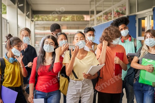 Preview: Group of students putting on or taking off their face masks.