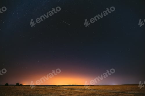 Preview: Natural Night Starry Sky Above Field Meadow. Glowing Stars, Mete