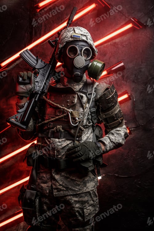 Preview: Soldier with gas mask holding rifle on his shoulder
