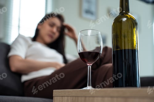Preview: Asian young depression woman feeling heart broken and drinking alcohol.