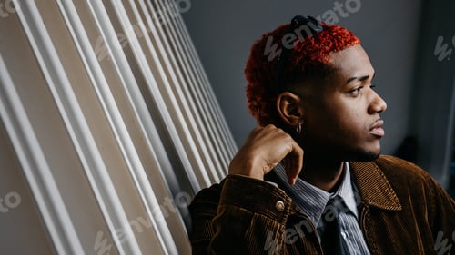 Preview: Profile portrait of a black man with thoughtful look