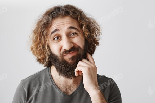 Preview: It would be problematic. Portrait of hesitating unsure eastern man scratching beard and lifting