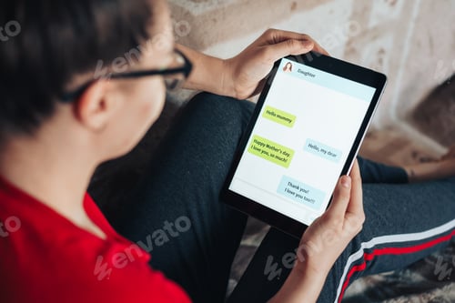 Preview: The daughter congratulates her mother on the holiday of mother's day by chat. Woman responds to