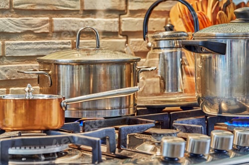 Preview: Several pots of cooking food on the gas stove at home in the kitchen. Home cooking concept