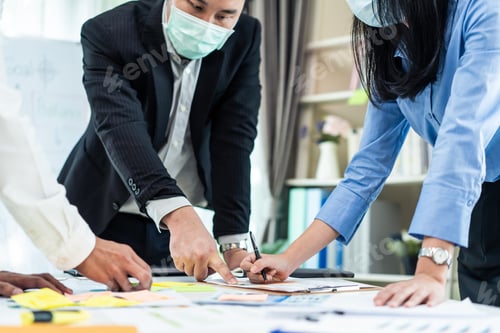 Preview: Group of Business people wear mask due to Covid19, meeting in office.