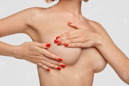 Preview: Photo of unrecognizable woman keeps hands on breast, treats cancer in mammologist, has hormonal chan