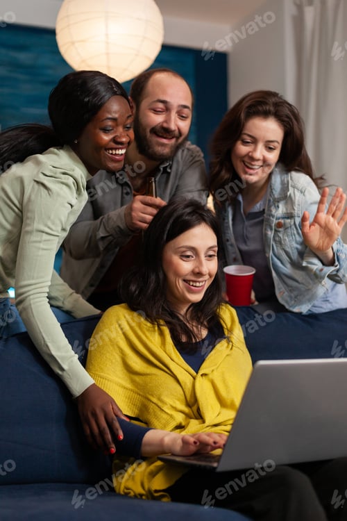 Preview: Multi ethnic friends waving at laptop webcam during video call