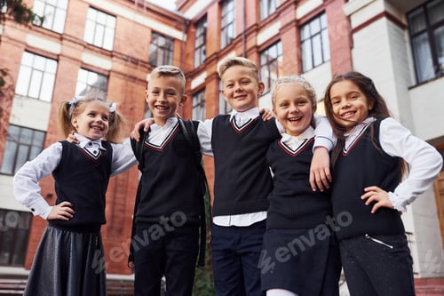 Preview: Group of kids in school uniform that is outdoors together near education building