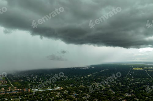Preview: Rainstorm shower over Florida rural town in humid summer season.
