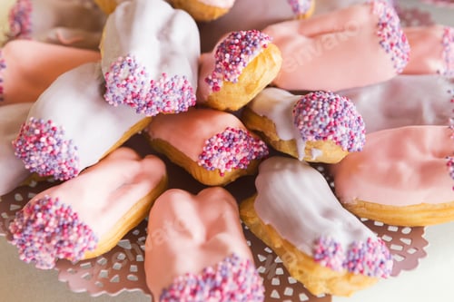 Preview: Eclairs with pink icing, closeup