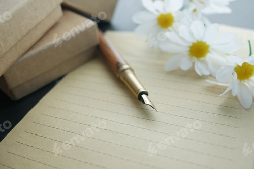 Preview: envelope , empty paper and fountain pen on table