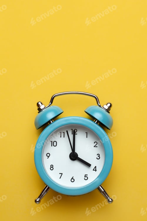 Preview: Blue round alarm clock on the cyan background.