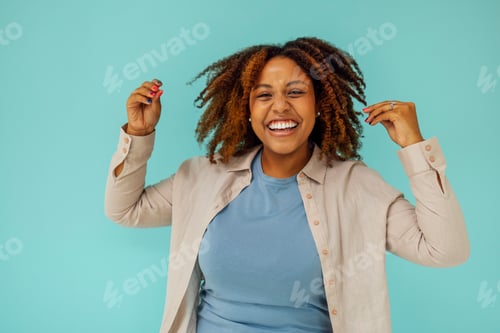 Preview: Cheerful good looking carefree young african american woman showing calm down