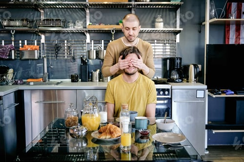 Preview: Young man covering eyes of his husbnd by hands