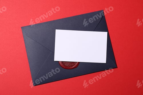 Preview: Blank card and envelope on red background, top view