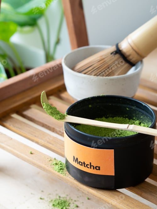 Preview: Matcha powder in container with bamboo scoop