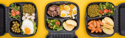 Preview: panoramic shot of eco packages with vegetables, apples, meat, fried eggs and salads isolated on