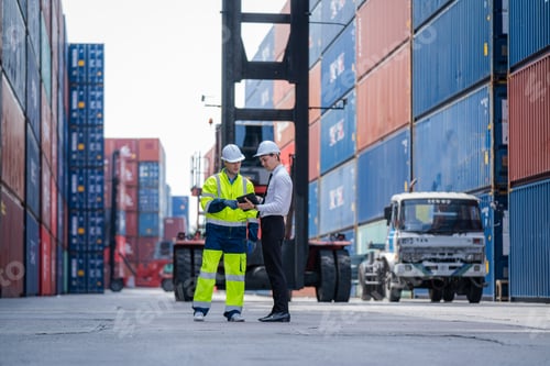 Preview: Professional container yard workers and co-worker having discussion on working plan together.