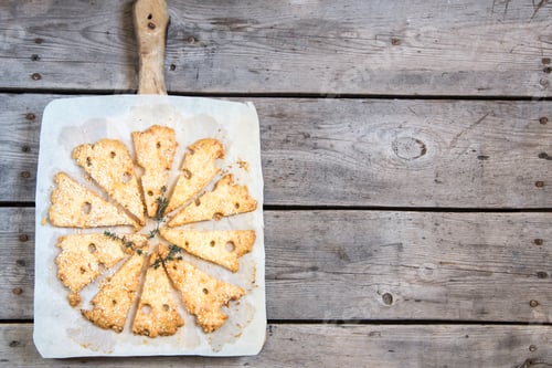 Preview: Homemade cheese baked cookies like cheese on a white plate and gray background