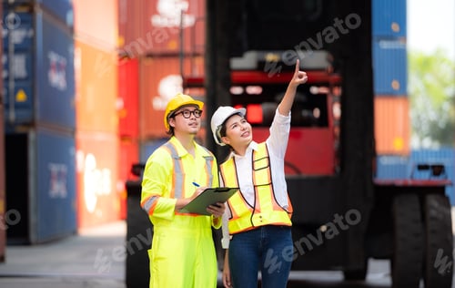Preview: Portrait of Asian woman engineer and worker working with co-worker at overseas shipping container