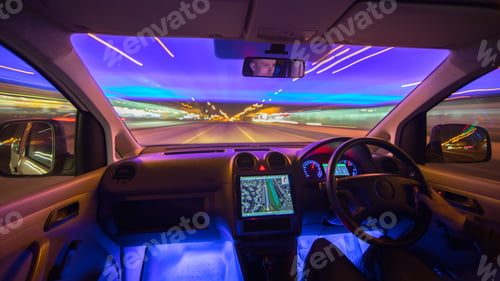 Preview: The man drive car in the city highway. Left side traffic. Evening night time
