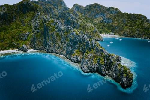 Preview: Miniloc Island with limestone cliffs. Aerial drone panoramic picture. Bacuit Archipelago, El Nido