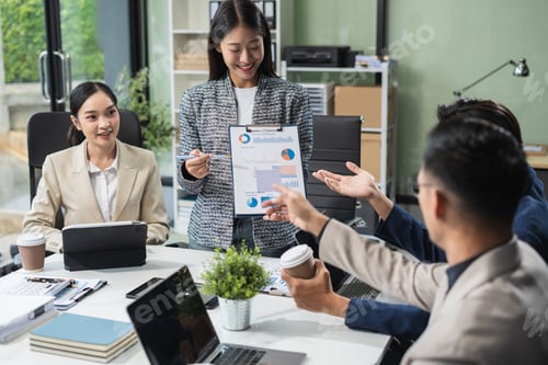 Preview: Business team working on a project in the office or reviewing and discussing a business project.