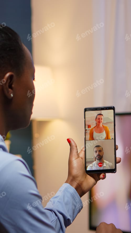 Preview: Black woman remote entrepreneur having video conference with friends