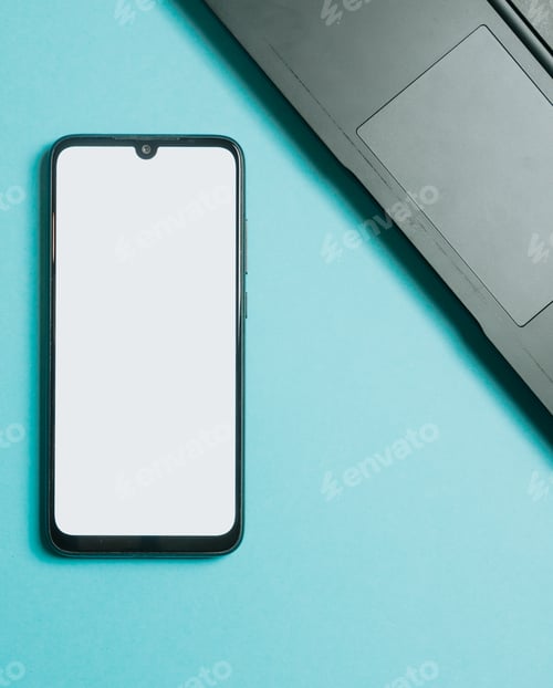 Preview: Flat lay design of a working space over blue pastel background. Mobile phone with blank space