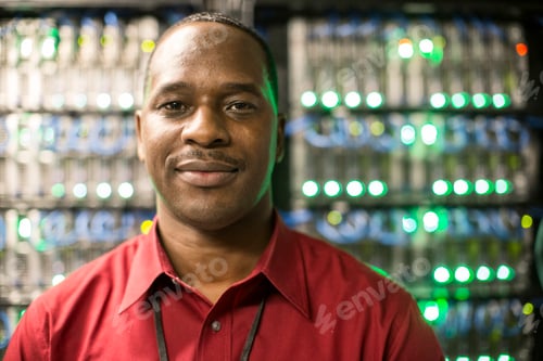 Preview: Black man technician in a computer server farm.