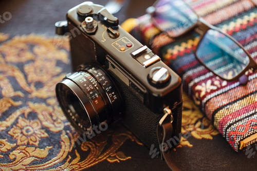 Preview: Vintage camera on a decorative table