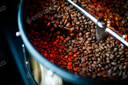 Preview: Coffee beans in a coffee machine, in dark colors.
