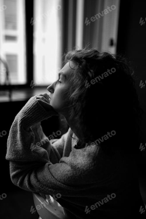 Preview: A girl sitting on chair. Bored girl. Sadness.
