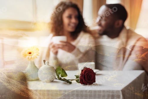 Preview: Positive Atmosphere. Close Up Of Eye Catching Red Rose Lying On The Table While Lovely Couple