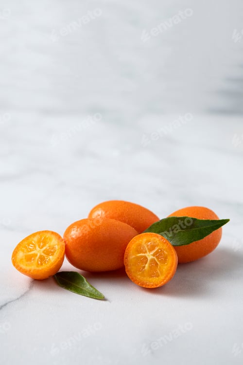 Preview: Kumquat fresh fruits on white marble