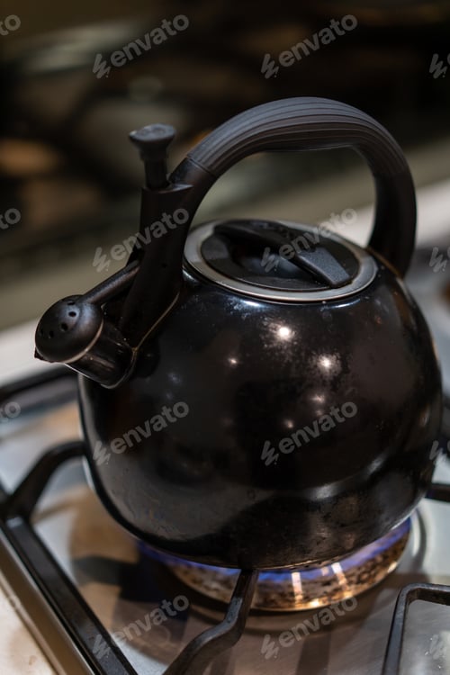 Preview: black kettle on a gas stove