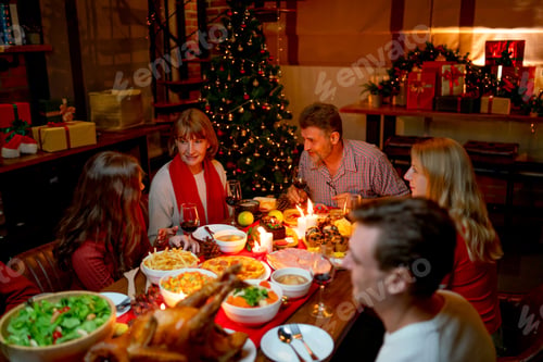 Preview: Member of big family enjoy together for dinner during Christmas with different age and generation