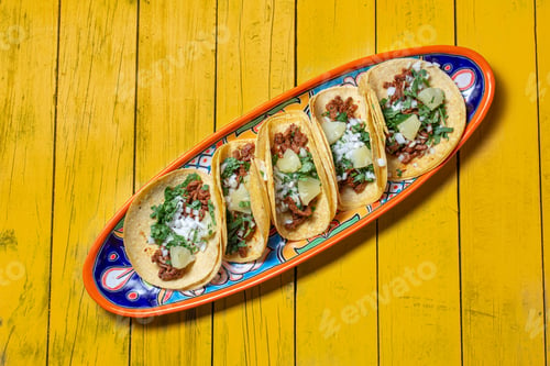 Preview: Mexican background with tacos al pastor and mexican sauces.