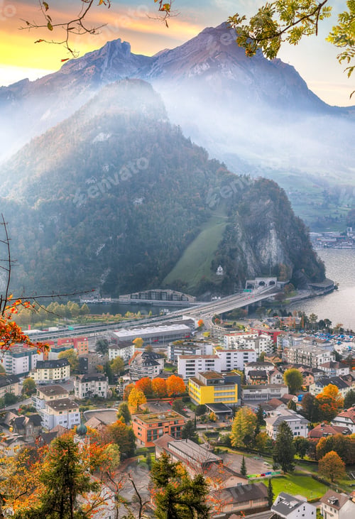 Preview: Exciting autumn view on suburb of Stansstad city and Lucerne lake with mountaines and fog